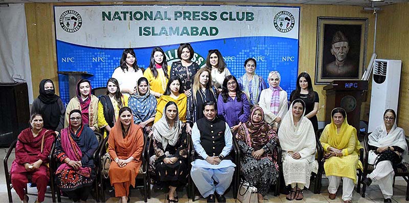 Speaker National Assembly Raja Pervez Ashraf in a group photo with participants of the reception to pay tribute to '' The Women Parliamentarians in Strengthening Democracy'' at National Press Club