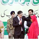 Caretaker Prime Minister Anwaar-ul-Haq Kakar distributes cheques of 2 million rupees each to individuals from the Christian community whose residences were damaged due to mob violence in Tehsil Jaranwala