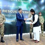 Caretaker Prime Minister Anwaar-ul-Haq Kakar distributing awards among the survivors of Battagram chairlift incident for their bravery at a ceremony