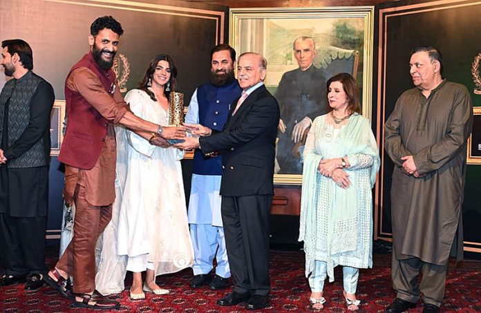 Prime Minister Shahbaz Sharif distributing award among the best performing Actors, Producers and Directors from Pakistan's Film Industry