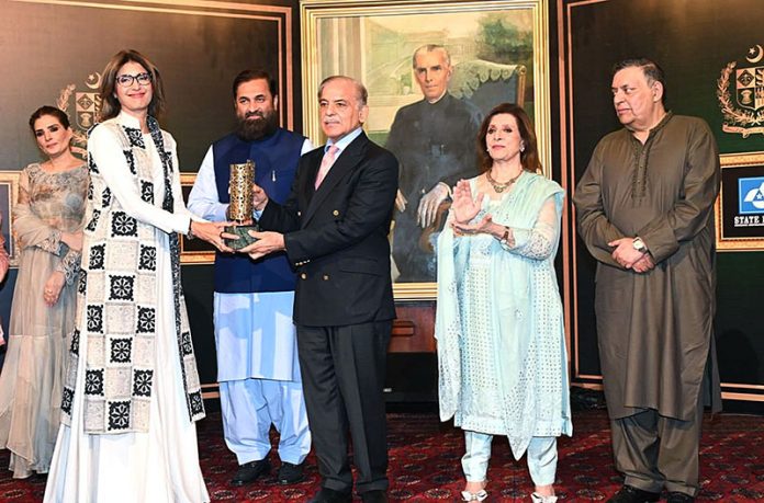Prime Minister Shahbaz Sharif distributing award among the best performing Actors, Producers and Directors from Pakistan's Film Industry