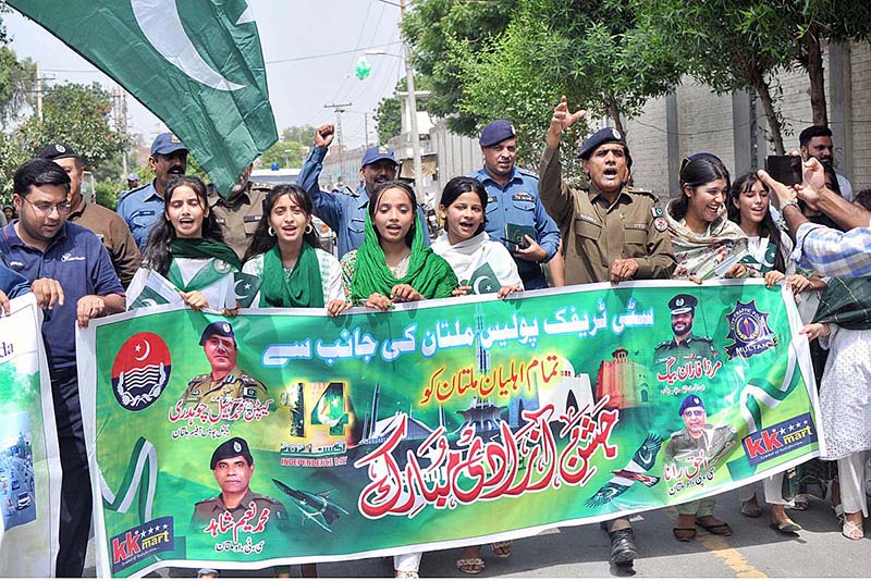 Students performing tableau during a ceremony organized by the City District Government at Ghanta Ghar on the occasion of 77th Independence Day celebration
