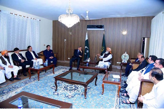 Prime Minister Muhammad Shehbaz Sharif offering condolences to President JUI-F for the party workers who were martyred in a suicide attack on JUI workers convention in Khar, Bajaur