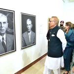 President Dr. Arif Alvi viewing a painting exhibition to pay tribute to Quaid-e-Azam Muhammad Ali Jinnah on Pakistan's Independence Day