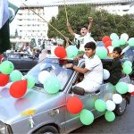 Children enjoying car ride decorated with balloons on the occasion of 77th Independence Day celebration