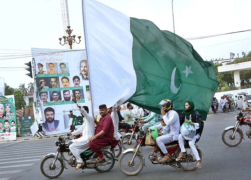 Children enjoying car ride decorated with balloons on the occasion of 77th Independence Day celebration