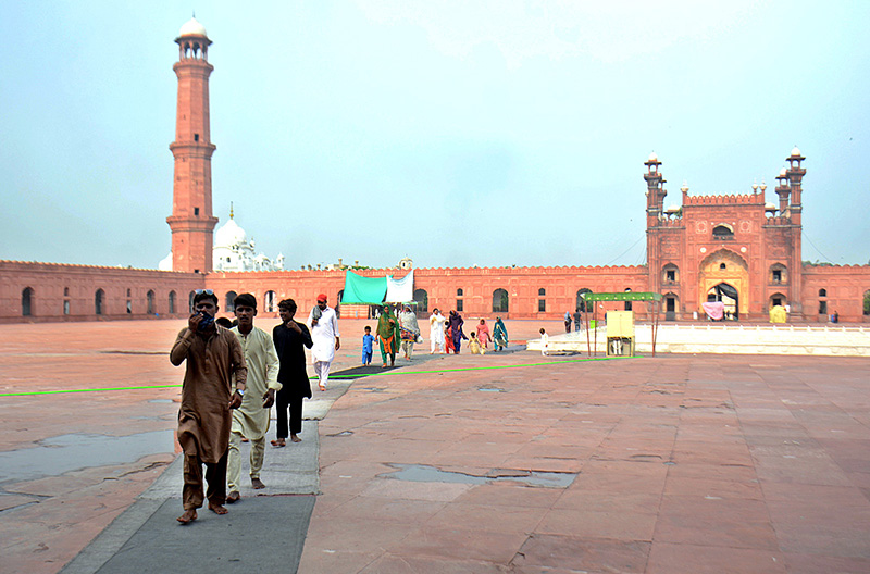 Visitors are exploring the historic Badshahi Mosque