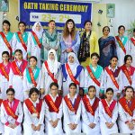 Principal Prof. Dr. Fariha Nighat in a group photograph with students during oath taking ceremony at Government College for Women, Dhoke Elahi Bakhsh