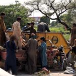 Gypsy people searching valuables from garbage near Khanna pul in the Federal Capital