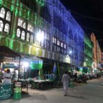 An illuminated view of Faizan-e-Madina Masjid decorated with colorful lights in connection with Eid Milad-un-Nabi (PBUH) celebrations