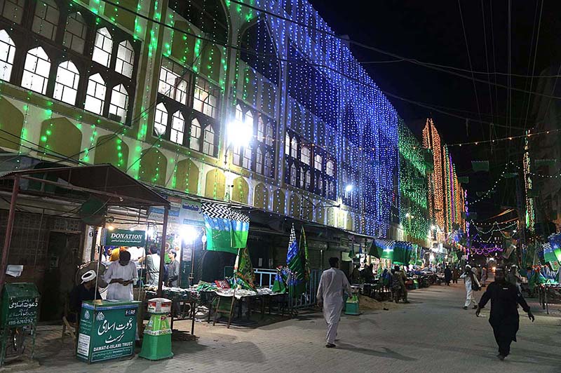 An illuminated view of Faizan-e-Madina Masjid decorated with colorful lights in connection with Eid Milad-un-Nabi (PBUH) celebrations