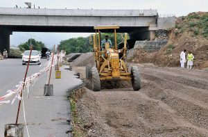 Heavy machinery being used for construction work of Margalla Road during development work in Federal Capital.