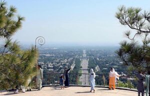 People having view of Federal Capital through famous picnic point Damn-e-Koh.