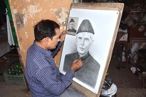  A painter giving final touch to portrait of Quaid-e-Azam in connection with death anniversary of Quaid-e-Azam Muhammad Ali Jinnah. 