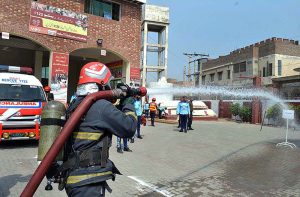 A group photo of Regional Emergency Officer Dr. Fawad Shahzad Mirza and District Emergency Officer Rescue 1122 Dr. Syed Mazhar Shah with District Bhakkar team during Inter Division Rescue Challenge at Rescue 1122 office, Aziz Bhatti Town.