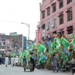 Shopkeepers displayed green flags outside their shops at Amin Pur Bazaar to attract the customers in connection with Eid Milad-un-Nabi (PBUH).