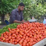 A vendor selling vegetables at Kalma chowk.
