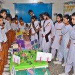 Students viewing models related Defence day exhibition at RC school.