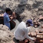 Labourers are preparing the sewage manhole at the Head Muhammad Wala Road