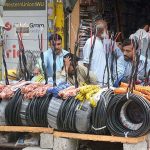 Vendor waiting for customers to sell electric wires at Kali Bari area.