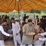 People are being served free food during a rally to mark Eid-e-Milad-un-Nabi (PBUH) at G-7 sector in the federal capital