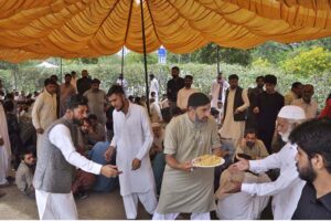 People are being served free food during a rally to mark Eid-e-Milad-un-Nabi (PBUH) at G-7 sector in the federal capital