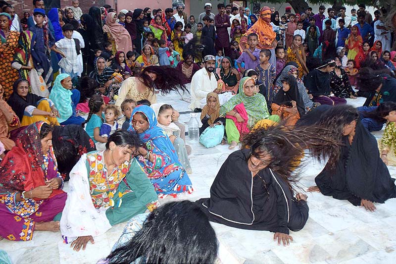 Sindh Caretaker Minister for Culture and Tourism Syed Dr. Junaid Shah and Sindh Caretaker Minister for Religious Affairs Muhammad Umar Soomro are enjoying the performance of folk artist who is singing a traditional song at the shrine of Shah Abdul Latif Bhitai on the occasion of 280th Urs celebration