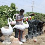 A roadside vendor displaying bird stuff to attract the customer at Eidgah road.