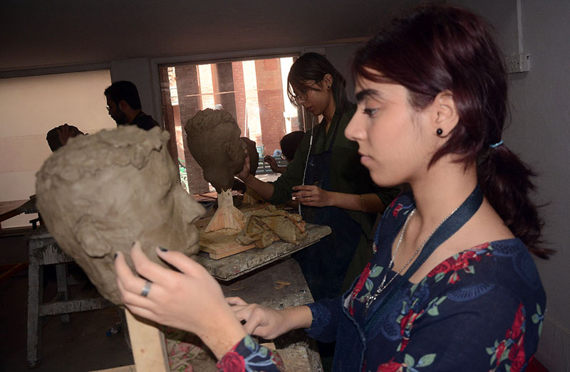Fine Art students busy in sculpturing at National College of Arts (NCA)