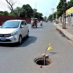 An open main hole of sewerage at Bilal Markaz Road near Iqbal stadium which needs the attention of the concerned authority.