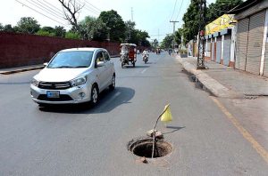An open main hole of sewerage at Bilal Markaz Road near Iqbal stadium which needs the attention of the concerned authority.