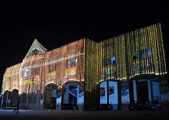 An illuminated view of Rescue 1122 building decorated with colorful lights in connection with Eid Milad-un-Nabi (PBUH) celebrations.