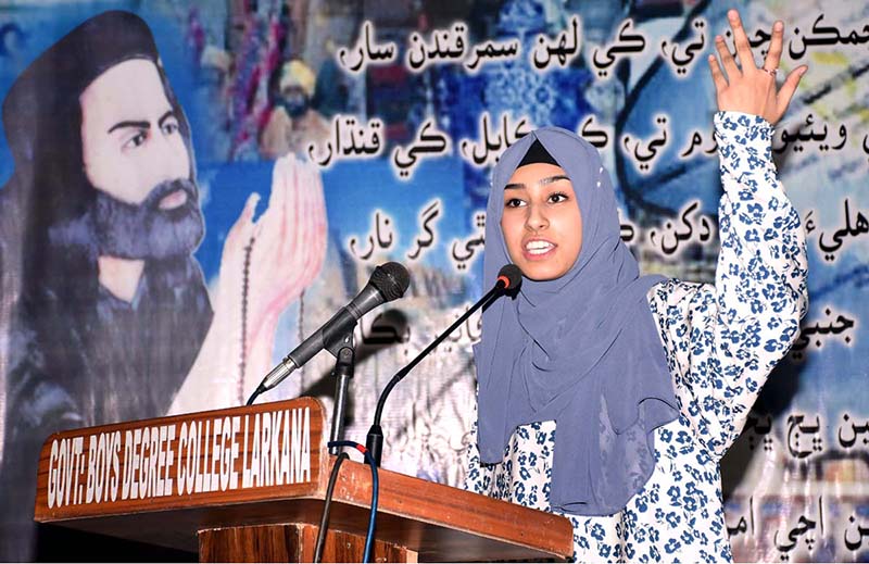 A student participates in poetry competition of Sindh's famous Sufi poet Shah Abdul Latif Bhitai during Latif Day Function at Government Degree College