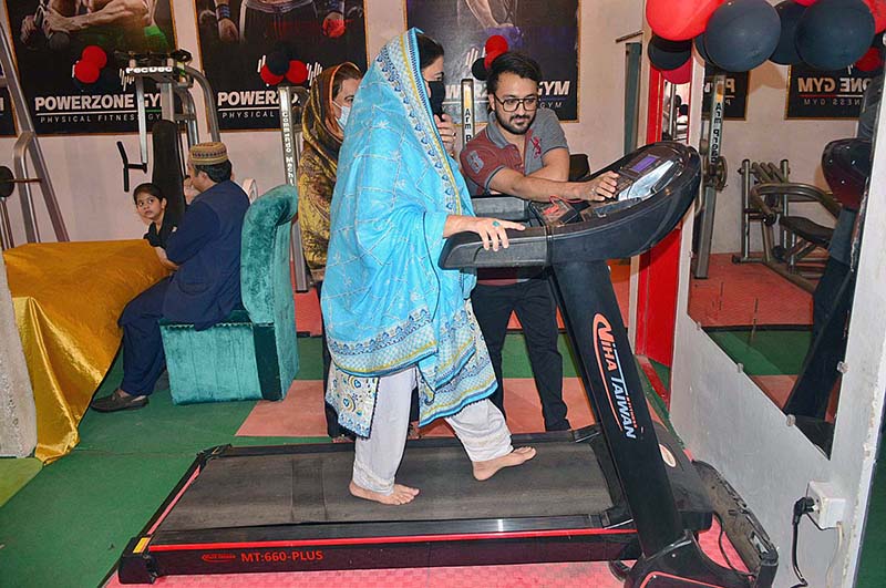 A woman walking on treadmill in Ladies GYM & fitness center at Latifabad.