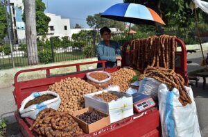 A vendor selling dry fruit in front of Company Bagh.