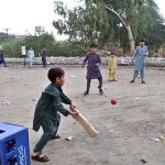 Children are playing cricket at old civil line