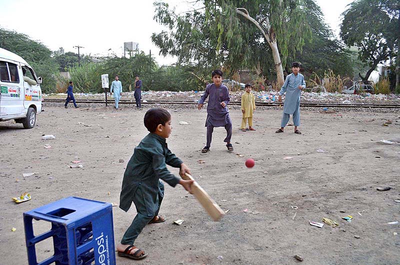 Children are playing cricket at old civil line