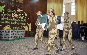 Students performing in tableau during ceremony on the occasion of Pakistan Defence Day at Islamabad Model College for Girls F-6/2.
