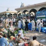A large number of people purchasing Vegetables at Vegetable and Fruits Market.
