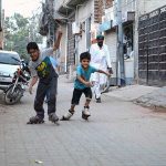 Children are enjoying skating in the street