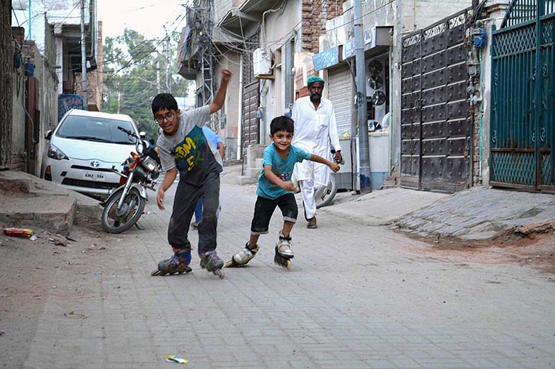 Children are enjoying skating in the street