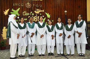 Students performing in tableau during ceremony on the occasion of Pakistan Defence Day at Islamabad Model College for Girls F-6/2.