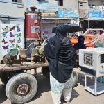 A vendor displaying the used home electronic items to attract the customers