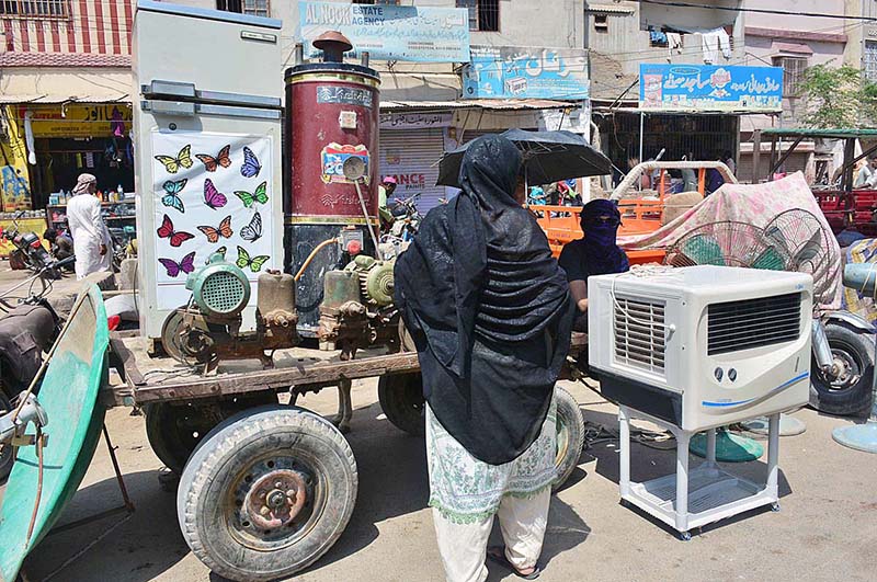A vendor displaying the used home electronic items to attract the customers