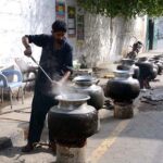 A cook preparing food to serve the participants of rally to mark birthday of the Holy Prophet Muhammad (Peace Be Upon Him) celebrating across the world