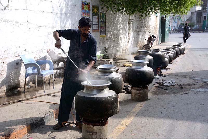 A cook preparing food to serve the participants of rally to mark birthday of the Holy Prophet Muhammad (Peace Be Upon Him) celebrating across the world