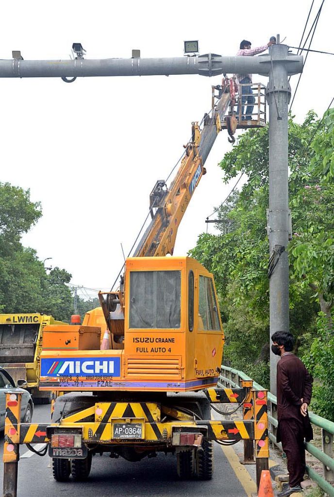 Staffers of safe city project are busy in maintenance work of CCTV