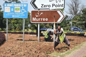 CDA gardener busy in preparing roadside greenbelt for planting flowers in Federal Capital