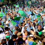A large number of people participating in a religious procession on the occasion of Eid Milad-ul-Nabi (PBUH)
