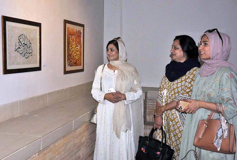 Female Visitors keenly viewing paintings during Pakistan National Council of the Arts is delighted to present a fantastic new calligraphy exhibition Titled “Mehar-e-Qalam” to celebrate the holy month of Rabi-ul-awal at PNCA.